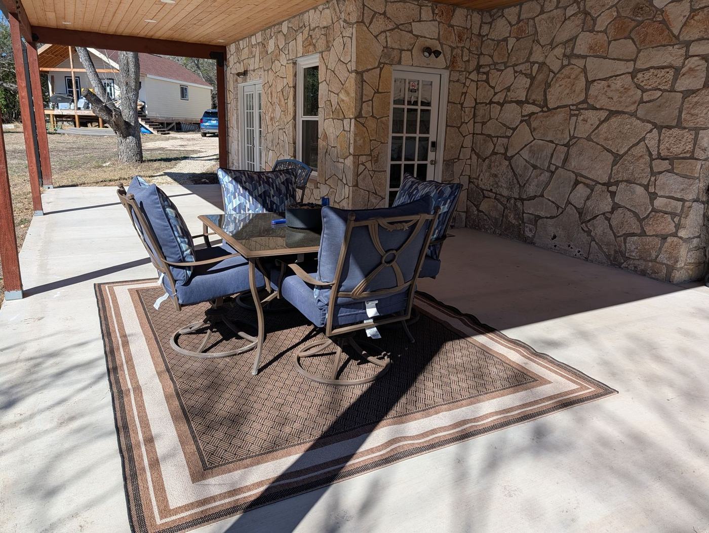 Patio seating along the stone wall