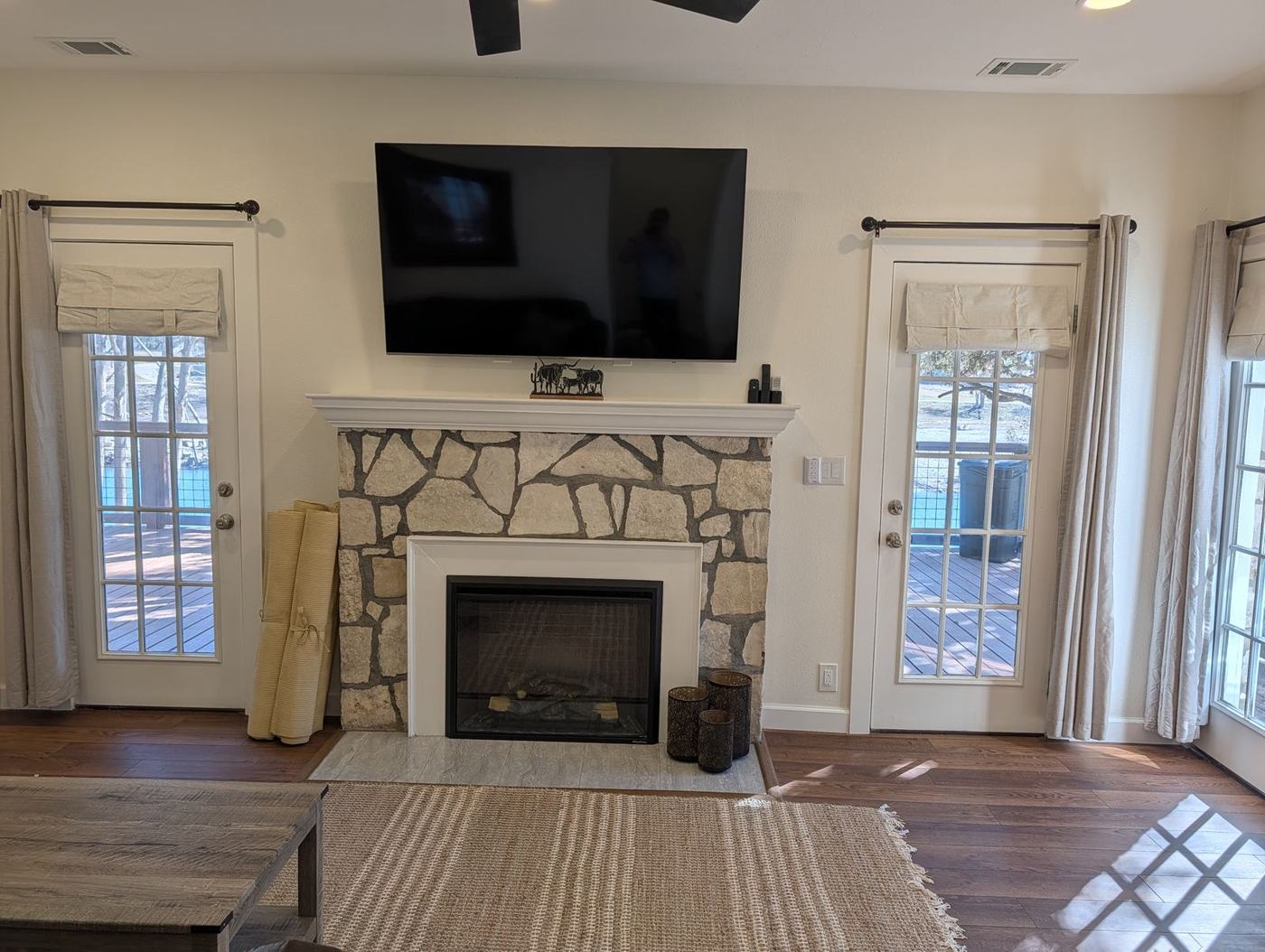 Stone fireplace and TV in the living room