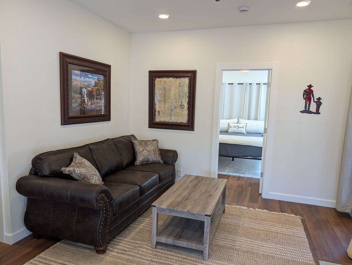 Living room with leather sofas and river-facing windows